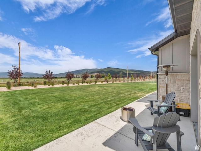 943 Hart Loop, Francis, UT 84036 - view of green lawn with a patio area, a mountain view, and a rural view