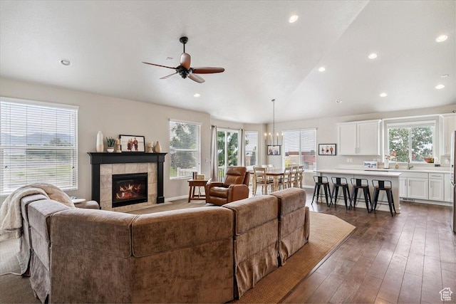 1820 W 950 N, Layton, UT 84041 - living area featuring a ceiling fan, plenty of natural light, dark wood-style floors, a tiled fireplace, and recessed lighting