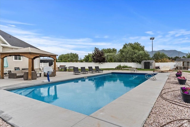 1820 W 950 N, Layton, UT 84041 - view of swimming pool with an outdoor hangout area, a storage shed, a patio area, a fenced backyard, and a gazebo