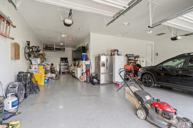 1820 W 950 N, Layton, UT 84041 - garage with stainless steel refrigerator with ice dispenser and a garage door opener