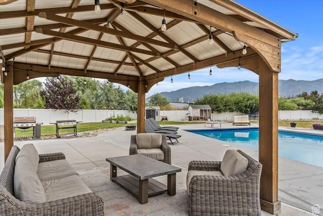 1820 W 950 N, Layton, UT 84041 - view of pool featuring a gazebo, a mountain view, a fenced backyard, and a storage unit