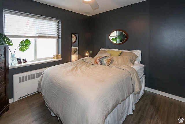 130 S 1300 E Unit 101, Salt Lake City, UT 84102 - bedroom featuring radiator heating unit, wood finished floors, and a ceiling fan