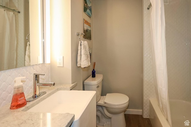 130 S 1300 E Unit 101, Salt Lake City, UT 84102 - bathroom with backsplash, vanity, shower / bath combo with shower curtain, and wood finished floors