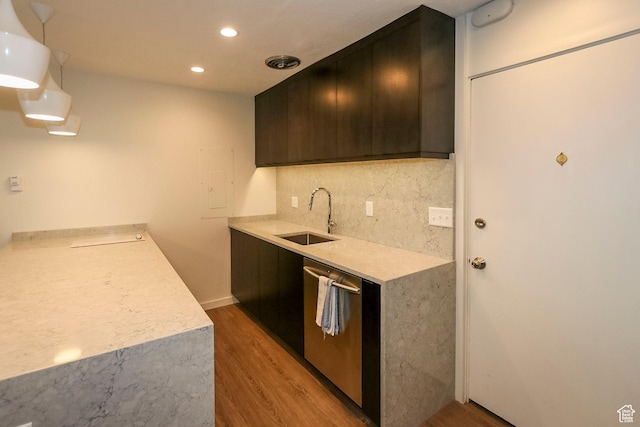 130 S 1300 E Unit 101, Salt Lake City, UT 84102 - kitchen with dishwasher, light wood-style flooring, light countertops, decorative backsplash, and recessed lighting