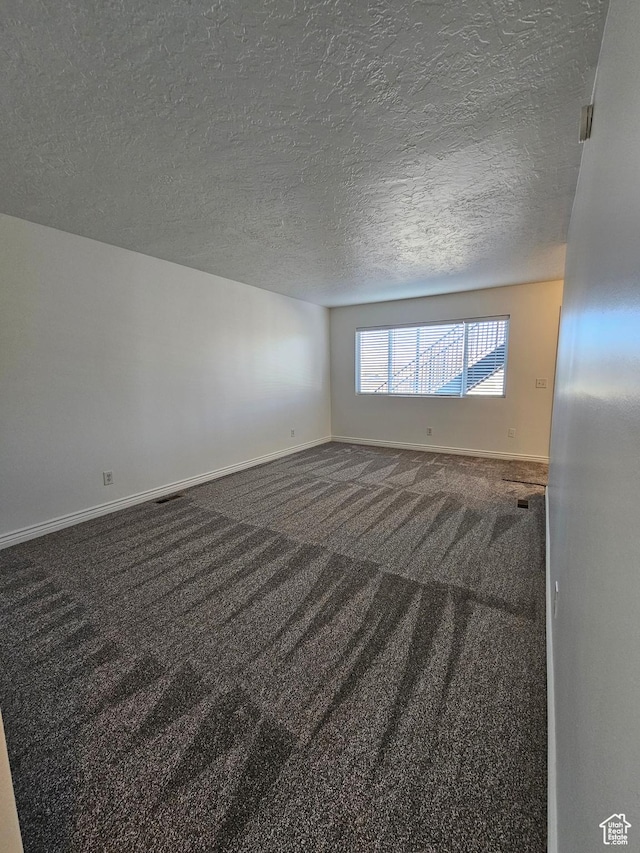 3673 S 2200 W Unit 15, West Valley City, UT 84119 - carpeted empty room featuring baseboards and a textured ceiling