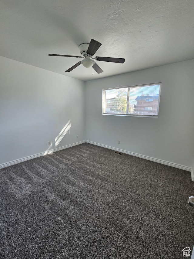 3673 S 2200 W Unit 15, West Valley City, UT 84119 - spare room featuring a ceiling fan and dark carpet