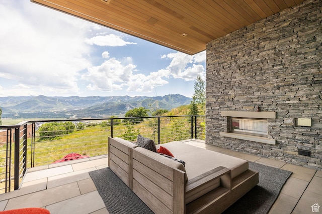 1433 Snow Berry St, Park City, UT 84098 - view of patio with a mountain view and an outdoor stone fireplace