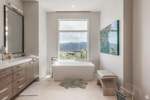 1433 Snow Berry St, Park City, UT 84098 - bathroom featuring a freestanding bath, healthy amount of natural light, vanity, and a mountain view