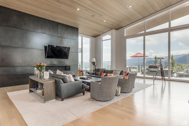 1433 Snow Berry St, Park City, UT 84098 - living room featuring expansive windows, wood ceiling, wood finished floors, and vaulted ceiling