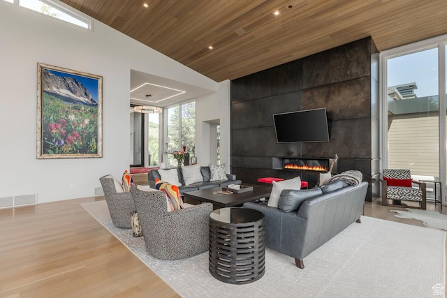 1433 Snow Berry St, Park City, UT 84098 - living area with wood finished floors, wooden ceiling, lofted ceiling, recessed lighting, and a fireplace