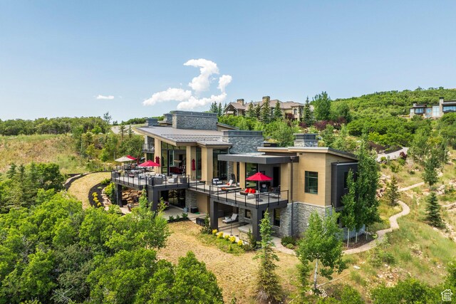 1433 Snow Berry St, Park City, UT 84098 - back of property featuring stone siding and a balcony