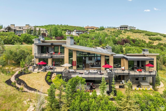 1433 Snow Berry St, Park City, UT 84098 - back of property with a balcony, a chimney, and a patio area