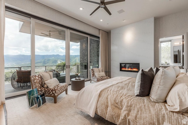 1433 Snow Berry St, Park City, UT 84098 - bedroom with a mountain view, access to exterior, a fireplace, recessed lighting, and a ceiling fan