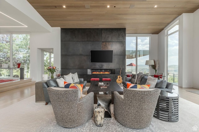 1433 Snow Berry St, Park City, UT 84098 - living room with wood ceiling, healthy amount of natural light, a fireplace, wood finished floors, and recessed lighting