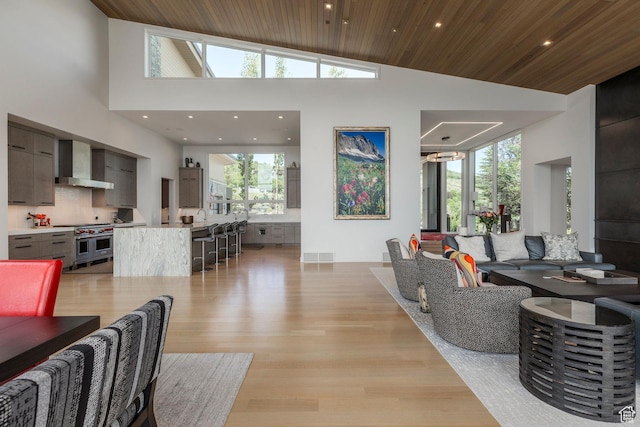 1433 Snow Berry St, Park City, UT 84098 - living area with wood ceiling, light wood-type flooring, recessed lighting, and a towering ceiling