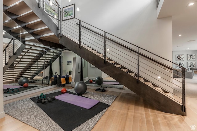 1433 Snow Berry St, Park City, UT 84098 - workout room with wood finished floors, a towering ceiling, and recessed lighting