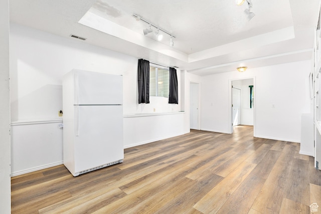 378 N 1180 E, Pleasant Grove, UT 84062 - spare room featuring a tray ceiling, track lighting, and light wood-style floors