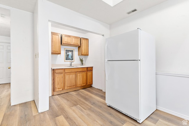 378 N 1180 E, Pleasant Grove, UT 84062 - kitchen featuring freestanding refrigerator, light wood finished floors, and light countertops