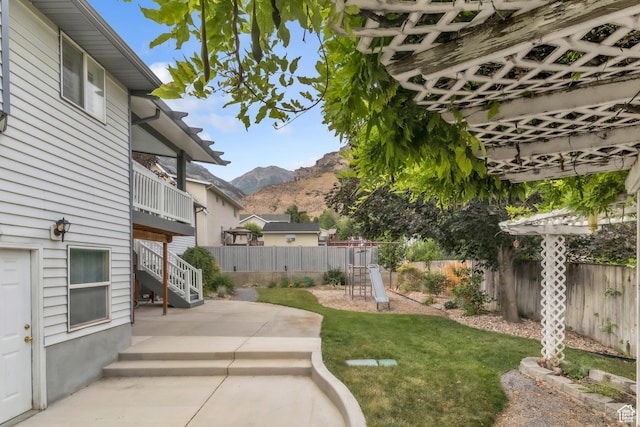378 N 1180 E, Pleasant Grove, UT 84062 - fenced backyard with a mountain view, a patio area, a playground, and stairs