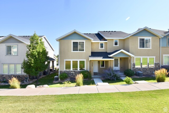 5063 W Arete Way, Herriman, UT 84096 - traditional-style home with stone siding, stucco siding, and a front yard