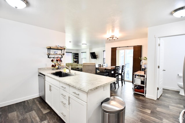 5063 W Arete Way, Herriman, UT 84096 - kitchen with a peninsula, light countertops, stainless steel dishwasher, and dark wood-style flooring