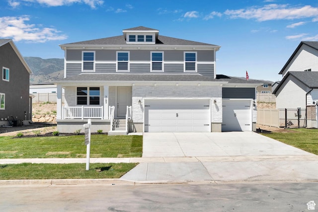 3362 S Zigzag Heron Dr Unit 813, Saratoga Springs, UT 84045 - american foursquare style home with a porch, a garage, concrete driveway, and stone siding