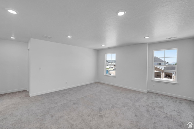 3362 S Zigzag Heron Dr Unit 813, Saratoga Springs, UT 84045 - spare room with recessed lighting and light colored carpet