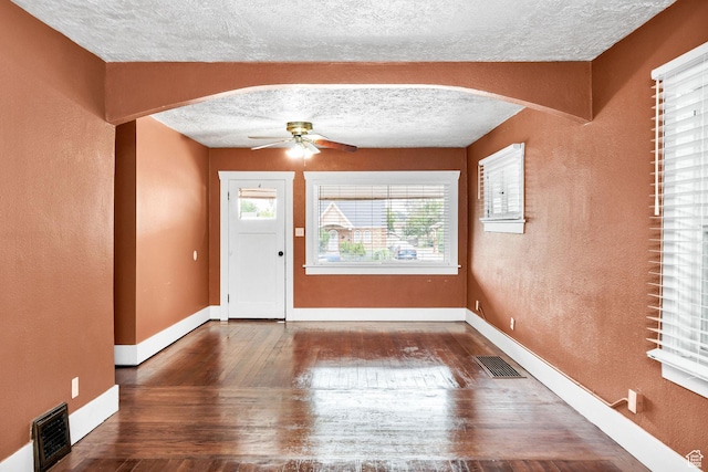 420 E 400 N, Logan, UT 84321 - entryway featuring arched walkways, a textured ceiling, ceiling fan, wood finished floors, and a textured wall