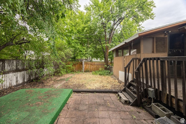 420 E 400 N, Logan, UT 84321 - fenced backyard featuring a sunroom and a patio area