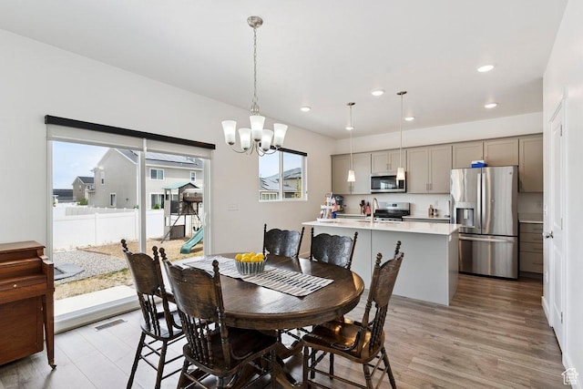 526 W 1360 N, Tooele, UT 84074 - dining room featuring a chandelier, recessed lighting, and light wood finished floors