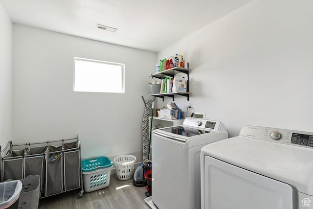 526 W 1360 N, Tooele, UT 84074 - laundry area featuring washing machine and dryer and wood finished floors