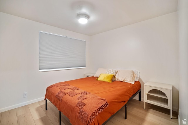 673 E 6th Ave, Salt Lake City, UT 84103 - bedroom with wood finished floors and baseboards