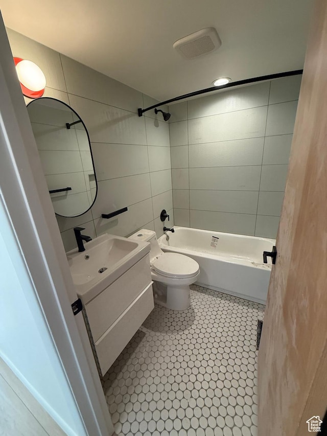 673 E 6th Ave, Salt Lake City, UT 84103 - full bathroom with vanity, tile walls,  shower combination, and tile patterned flooring