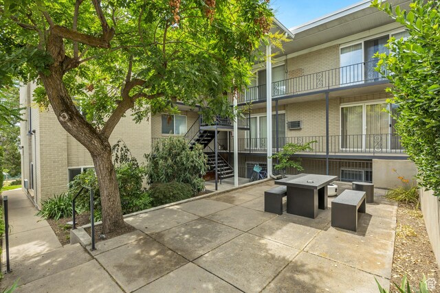 673 E 6th Ave, Salt Lake City, UT 84103 - view of home's community with a patio and stairs