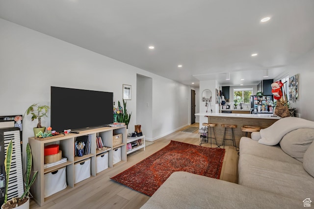 673 E 6th Ave, Salt Lake City, UT 84103 - living room featuring light wood finished floors and recessed lighting