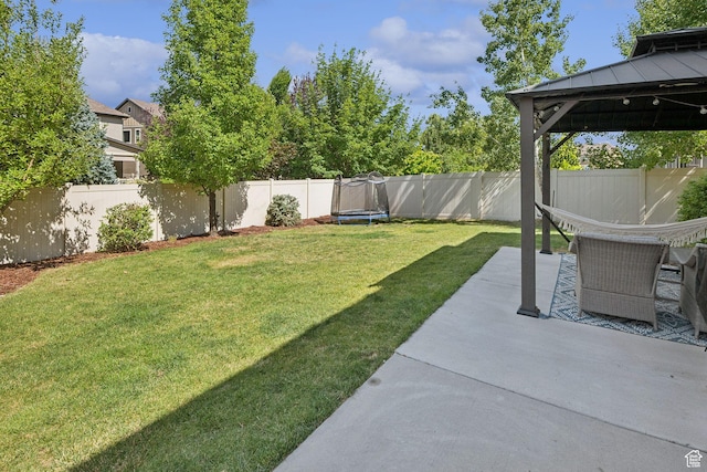 13159 S Herriman Rose Blvd, Herriman, UT 84096 - fenced backyard with a trampoline, a gazebo, and a patio area