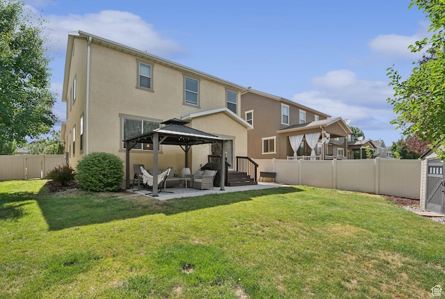 13159 S Herriman Rose Blvd, Herriman, UT 84096 - rear view of house featuring a gazebo, stucco siding, a fenced backyard, and a patio