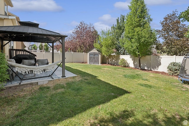 13159 S Herriman Rose Blvd, Herriman, UT 84096 - fenced backyard featuring a trampoline, a gazebo, a storage unit, and a patio