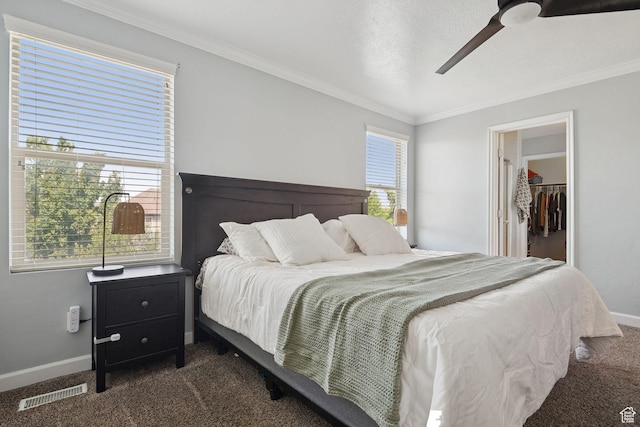 13159 S Herriman Rose Blvd, Herriman, UT 84096 - bedroom featuring dark colored carpet, crown molding, a spacious closet, and ceiling fan