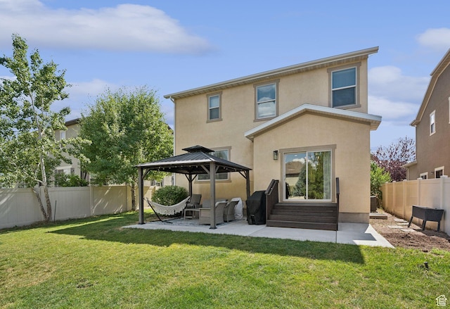 13159 S Herriman Rose Blvd, Herriman, UT 84096 - back of house featuring entry steps, a gazebo, a patio area, stucco siding, and a fenced backyard