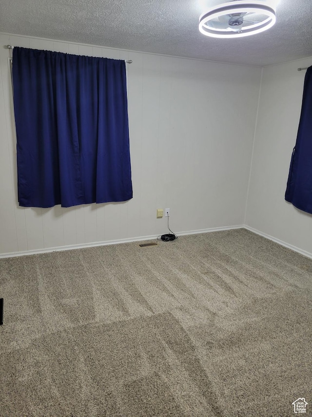396 S 100 E, Tooele, UT 84074 - spare room featuring carpet and a textured ceiling