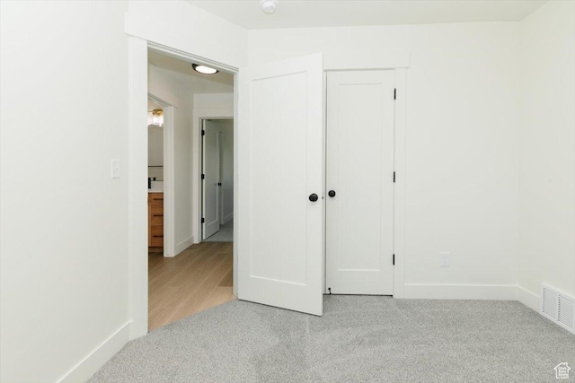 821 E 160 N, Hyde Park, UT 84318 - unfurnished bedroom with light colored carpet and a closet