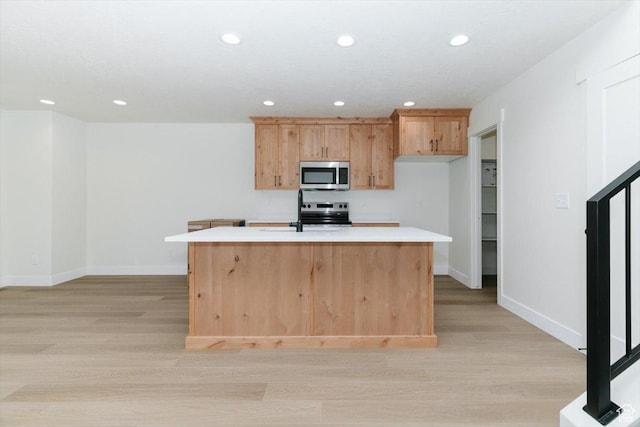 821 E 160 N, Hyde Park, UT 84318 - kitchen with appliances with stainless steel finishes, light wood-style floors, light countertops, recessed lighting, and a kitchen island