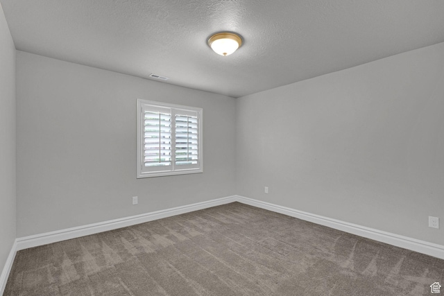 5575 S 1350 E, South Ogden, UT 84403 - unfurnished room with a textured ceiling and carpet floors
