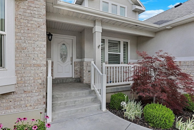 5575 S 1350 E, South Ogden, UT 84403 - entrance to property featuring stucco siding, a porch, brick siding, and a shingled roof