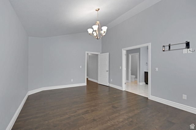 5575 S 1350 E, South Ogden, UT 84403 - unfurnished room with a chandelier, wood finished floors, and high vaulted ceiling