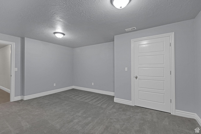 5575 S 1350 E, South Ogden, UT 84403 - below grade area with a textured ceiling and dark colored carpet