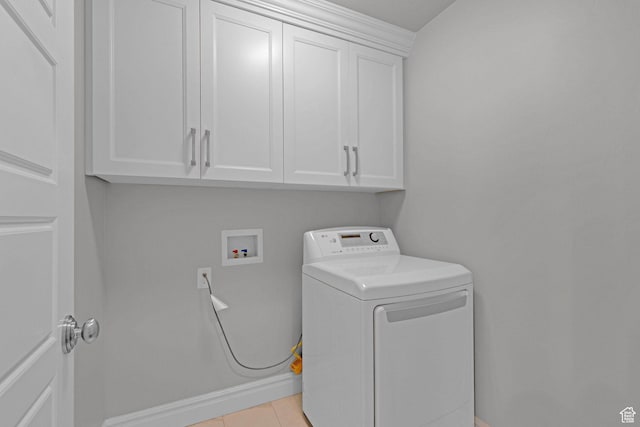 5575 S 1350 E, South Ogden, UT 84403 - washroom featuring washer / dryer, cabinet space, and light tile patterned flooring