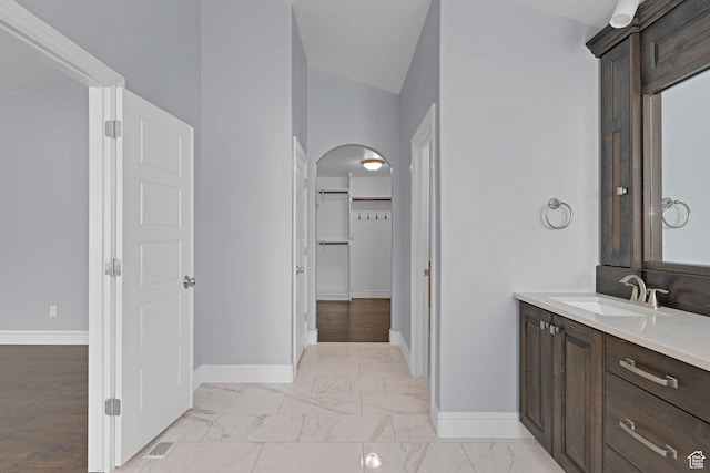 5575 S 1350 E, South Ogden, UT 84403 - full bathroom with vanity, a walk in closet, and marble finish flooring