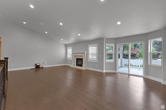 5575 S 1350 E, South Ogden, UT 84403 - unfurnished living room with a glass covered fireplace, recessed lighting, and dark wood-style floors